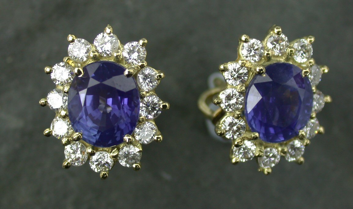 A pair of 18ct gold mounted sapphire and diamond cluster earstuds,