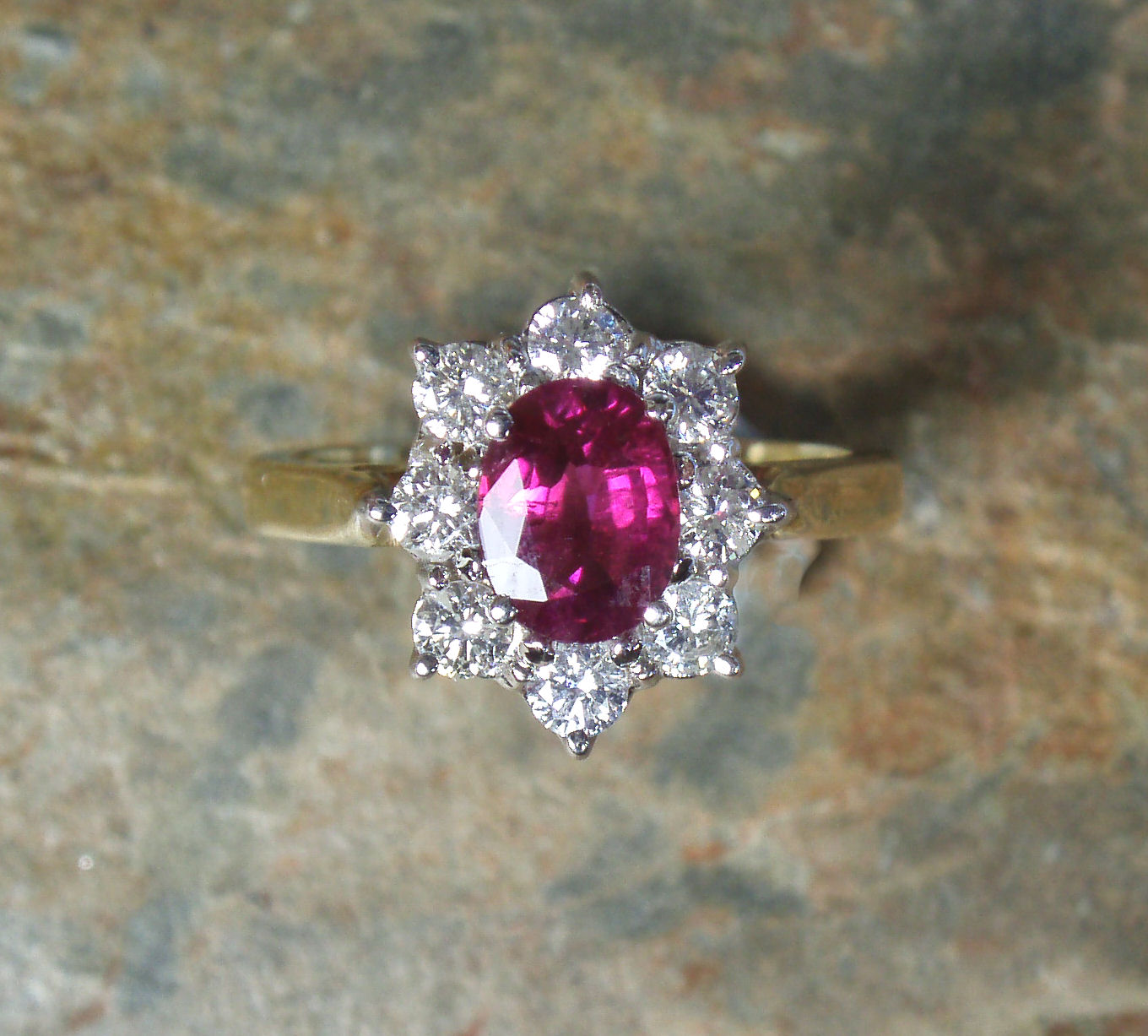 An 18ct gold mounted ruby and diamond cluster ring,