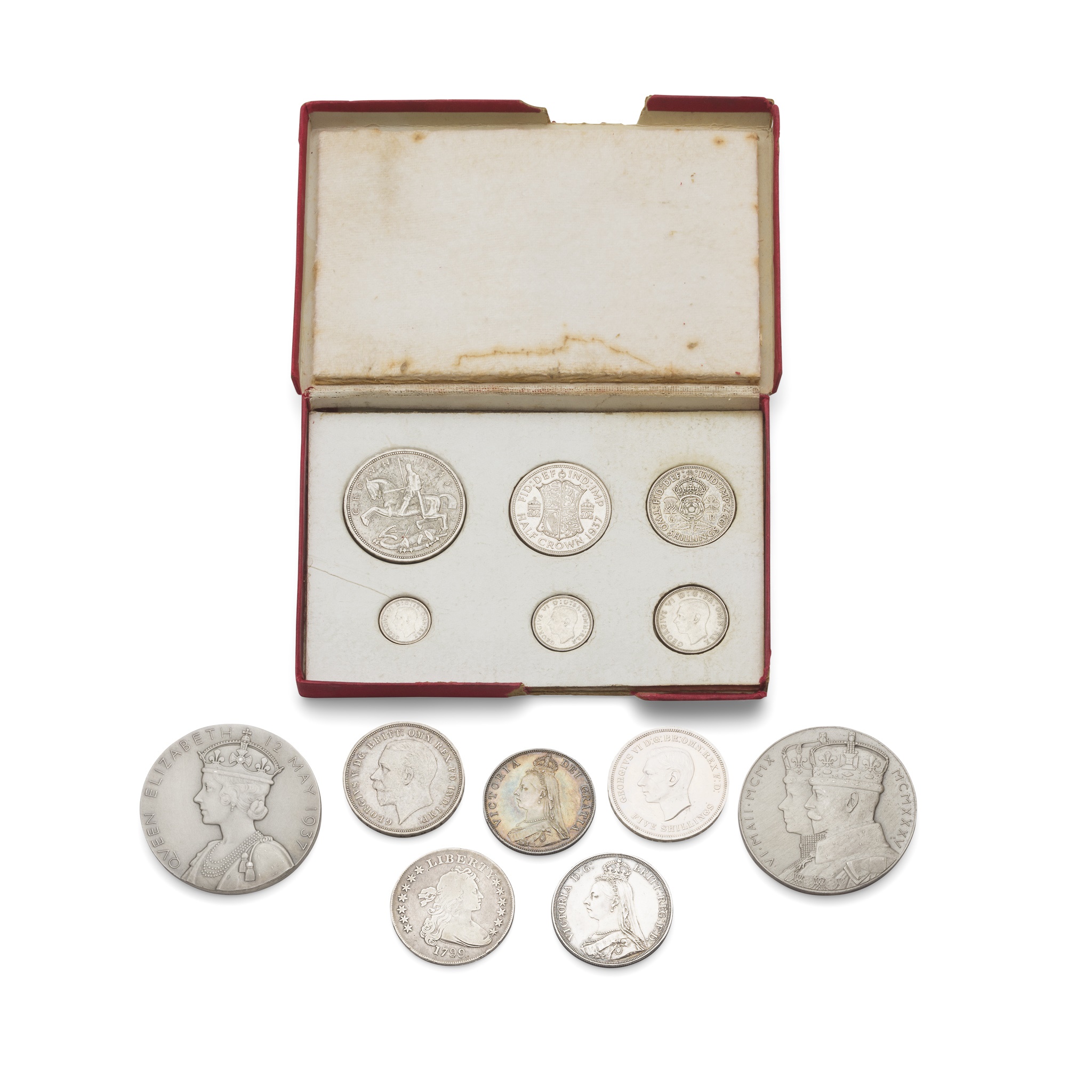 A group of silver coins and coronation medals