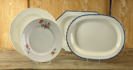 A set of four large circular ceramic dishes