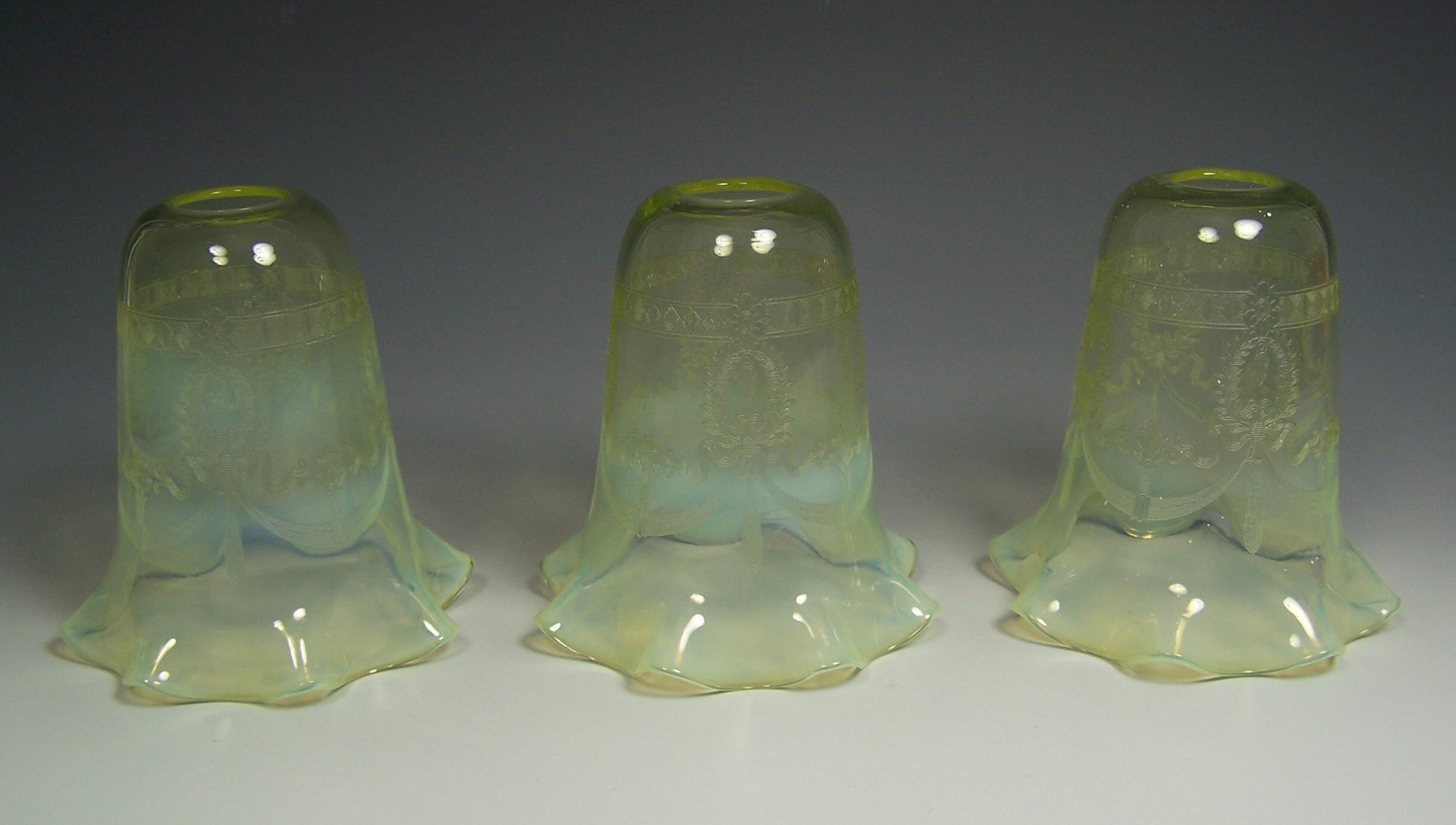 THREE VASELINE GLASS SHADES