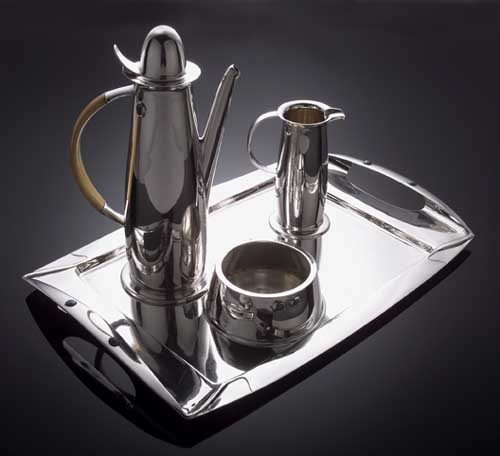 A Liberty & Co. 'Cymric' silver coffee service, designed by Archibald Knox,