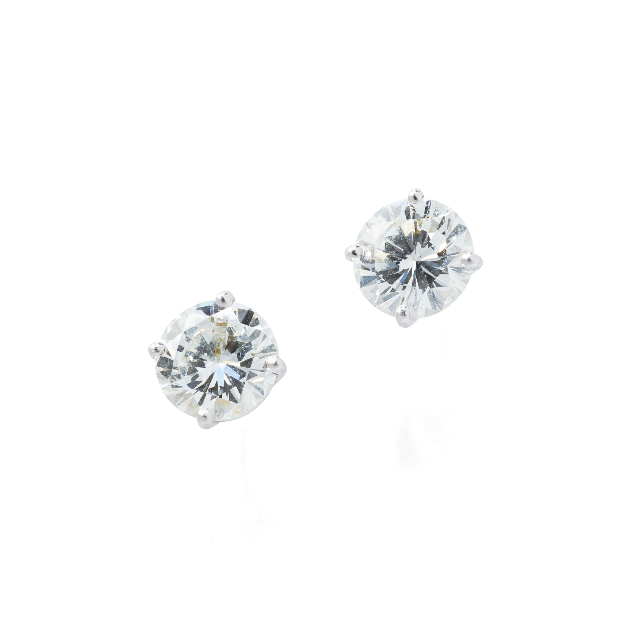 A pair of diamond stud earrings