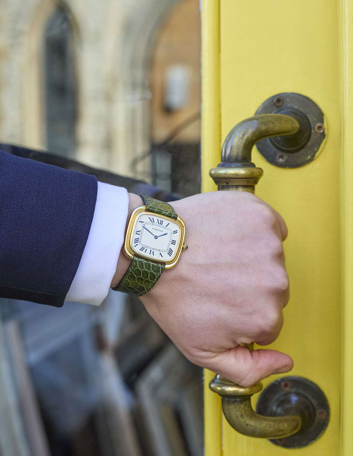 Cartier: An oversized gold square wristwatch