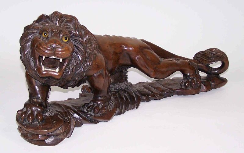A Chinese hardwood roaring lion ALTERATION not Japanese