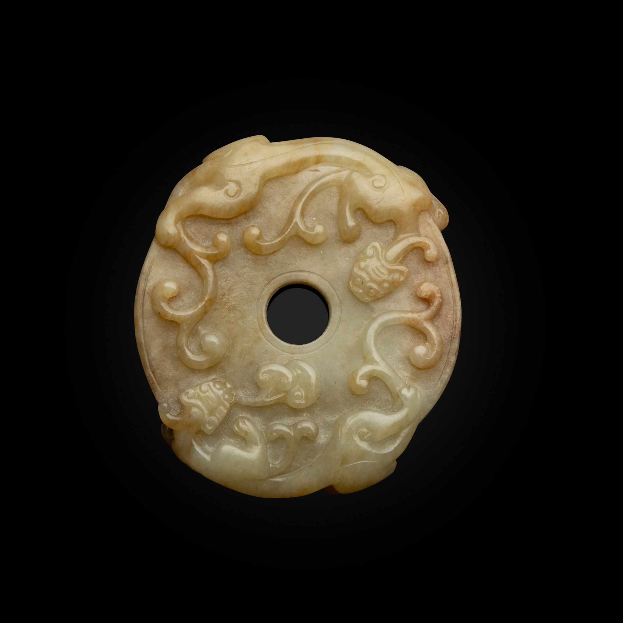 CHINESE CELADON JADE WITH RUSSET INCLUSIONS 'CHI-DRAGON' DISC PENDANT