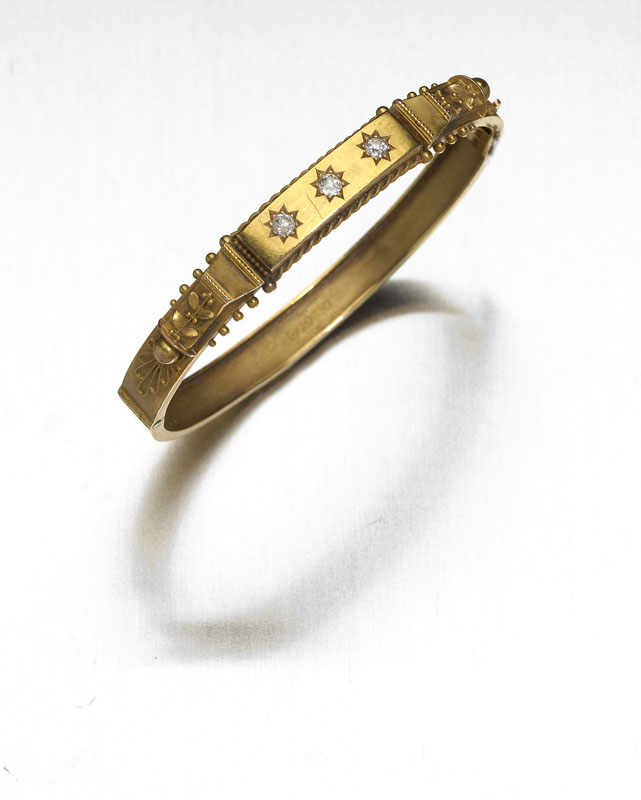 A Victorian 15ct gold diamond set bangle,