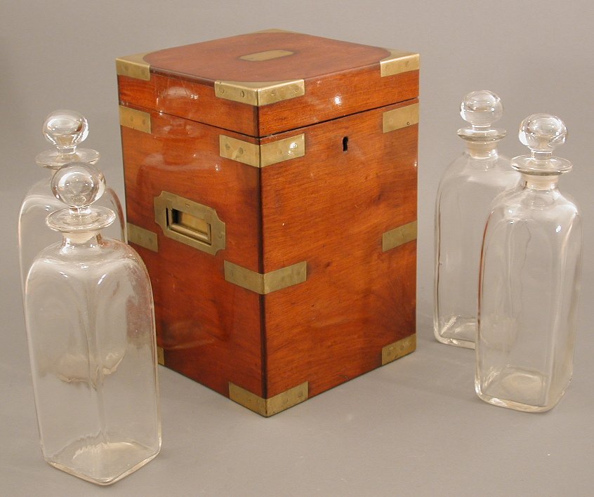 An early 19th century mahogany and brass bound box