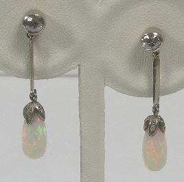 A pair of opal and diamond pendant earrings,