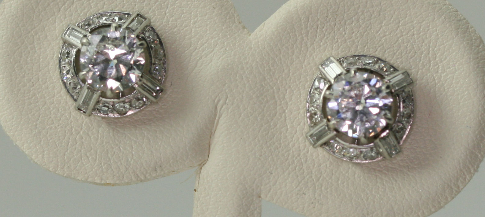 A pair of early 20th century diamond cluster earrings,