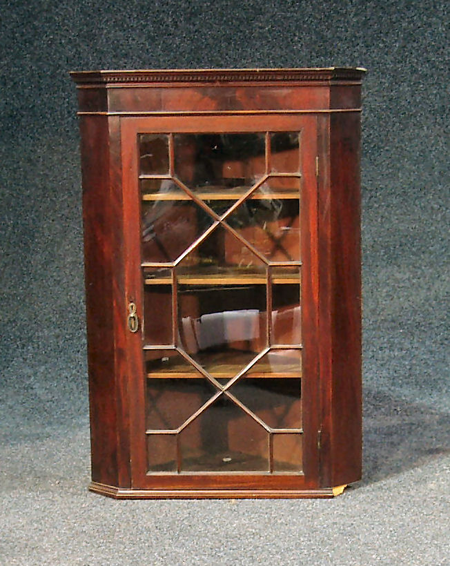 A 19th century mahogany glazed corner cabinet