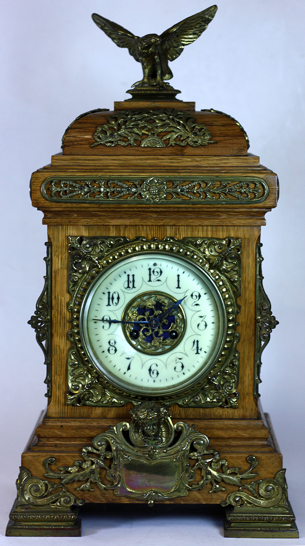 EDWARDIAN OAK AND GILT BRASS MOUNTED BRACKET CLOCK