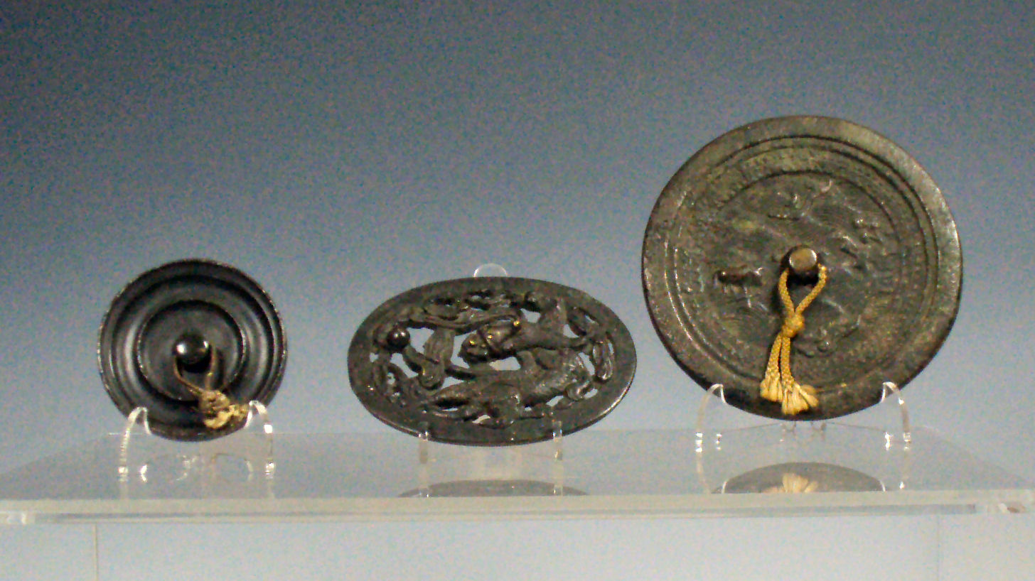 Two 19th century Chinese bronze hand mirrors