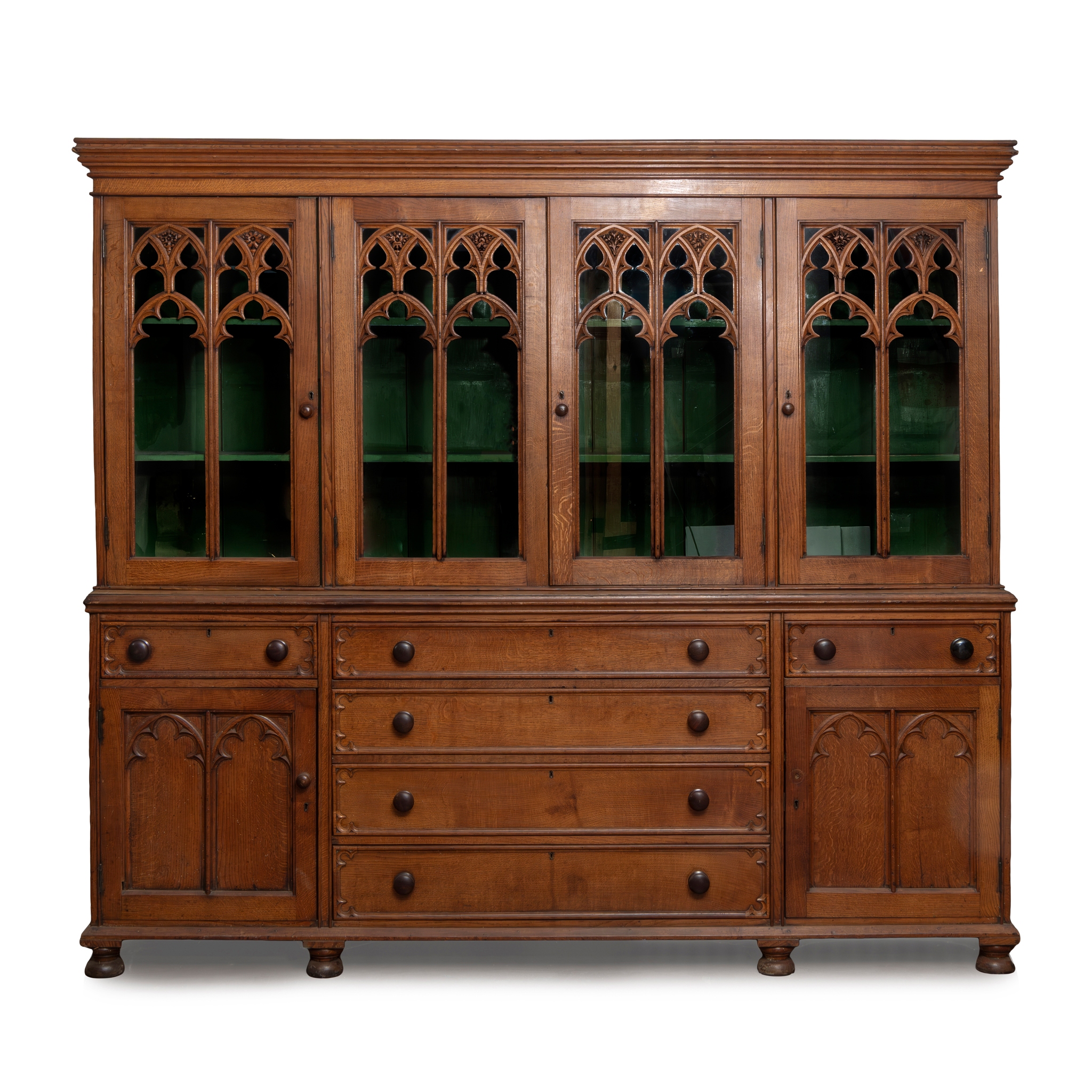 A LATE VICTORIAN OAK GOTHIC REVIVAL BOOKCASE