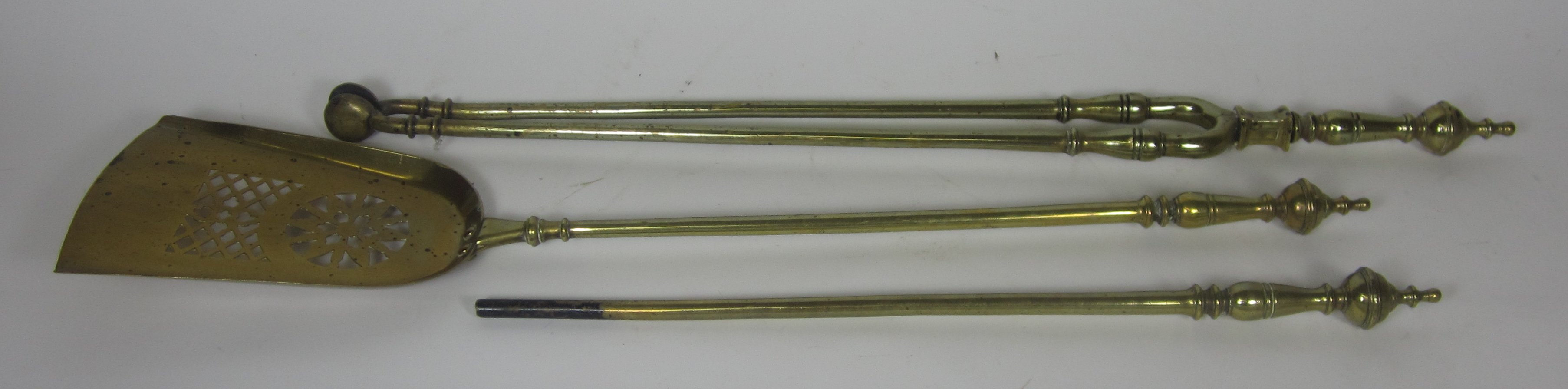 GROUP OF BRASS FIRE IRONS