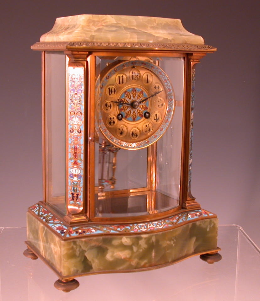 A French gilt brass and cloisonne decorated onyx mantel clock