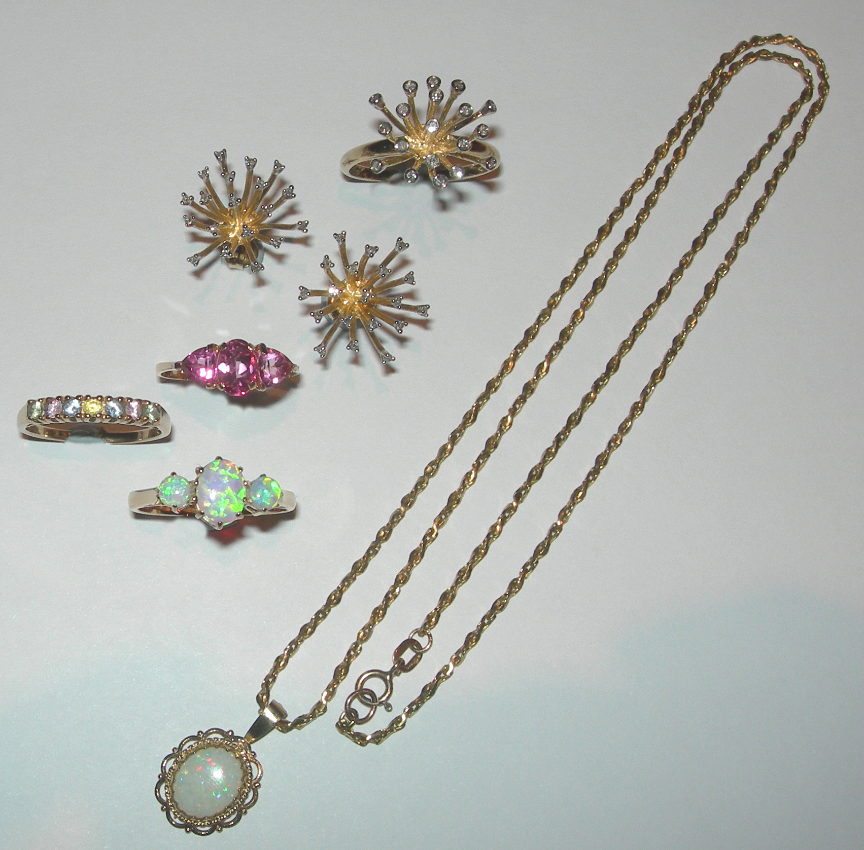 A contemporary 9ct gold mounted diamond set suite,