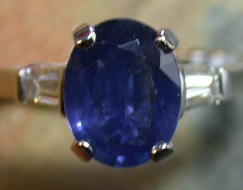 A sapphire and diamond three stone ring,