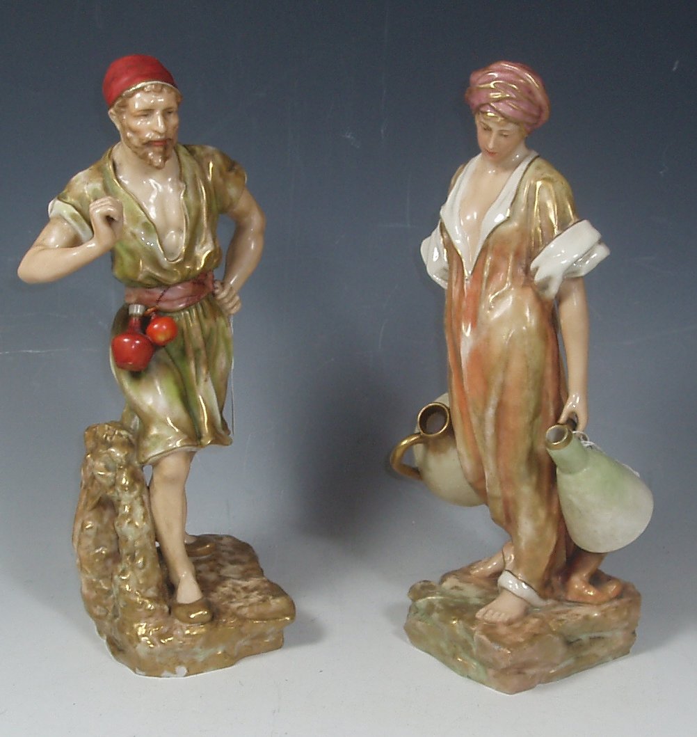 A pair of Nautilus porcelain figures,