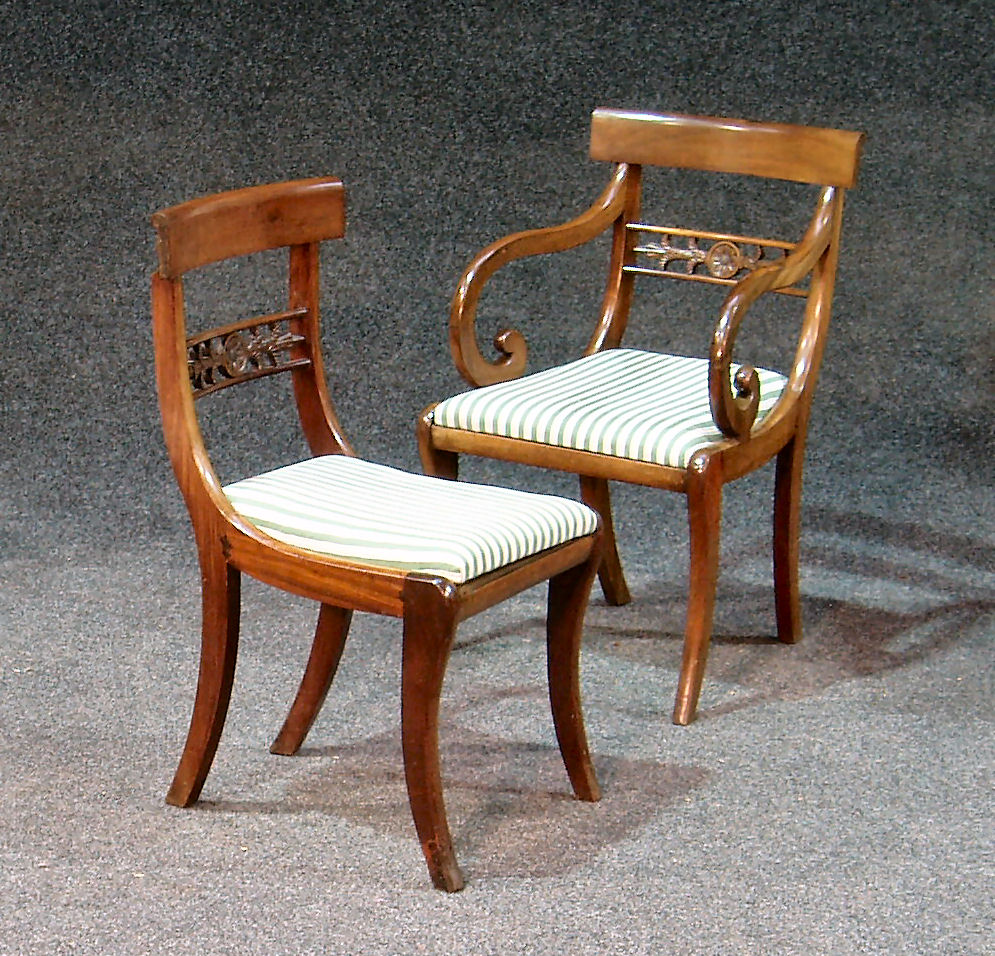 A set of four Regency style mahogany dining chairs