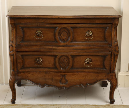 A 19th century French provincial walnut commode