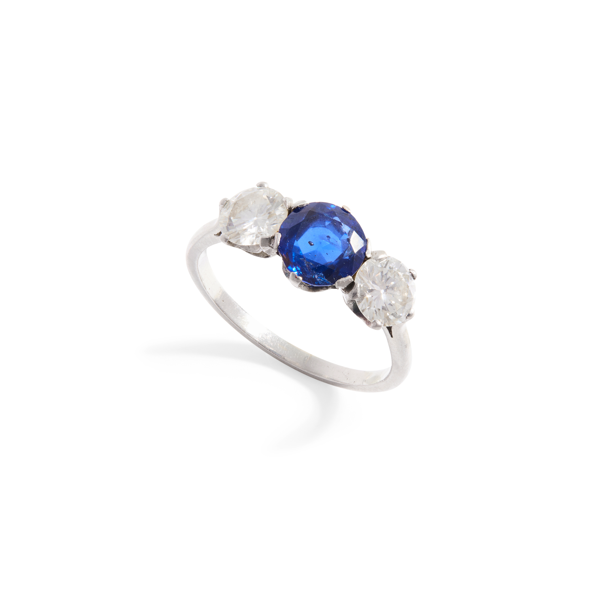 A sapphire and diamond three-stone ring