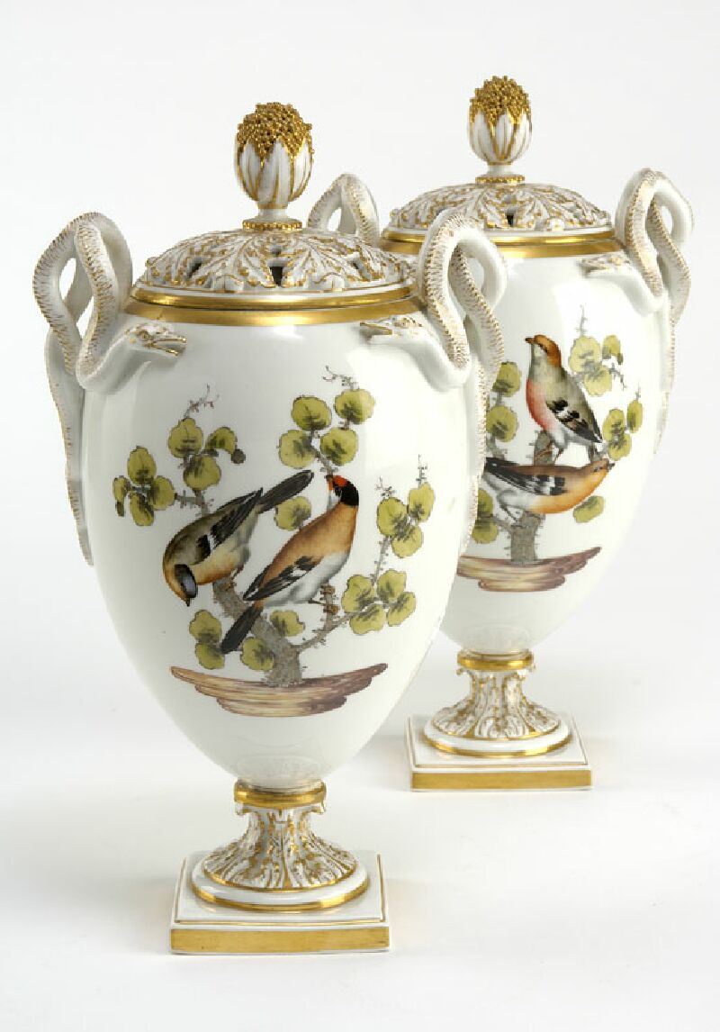 A pair of late 19th century Meissen urns and covers