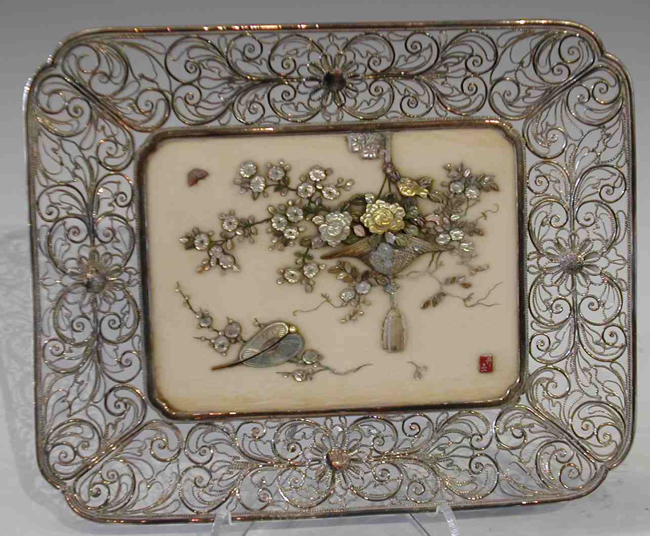 A Japanese rounded rectangular Shibayama decorated ivory plaque, Meiji period,