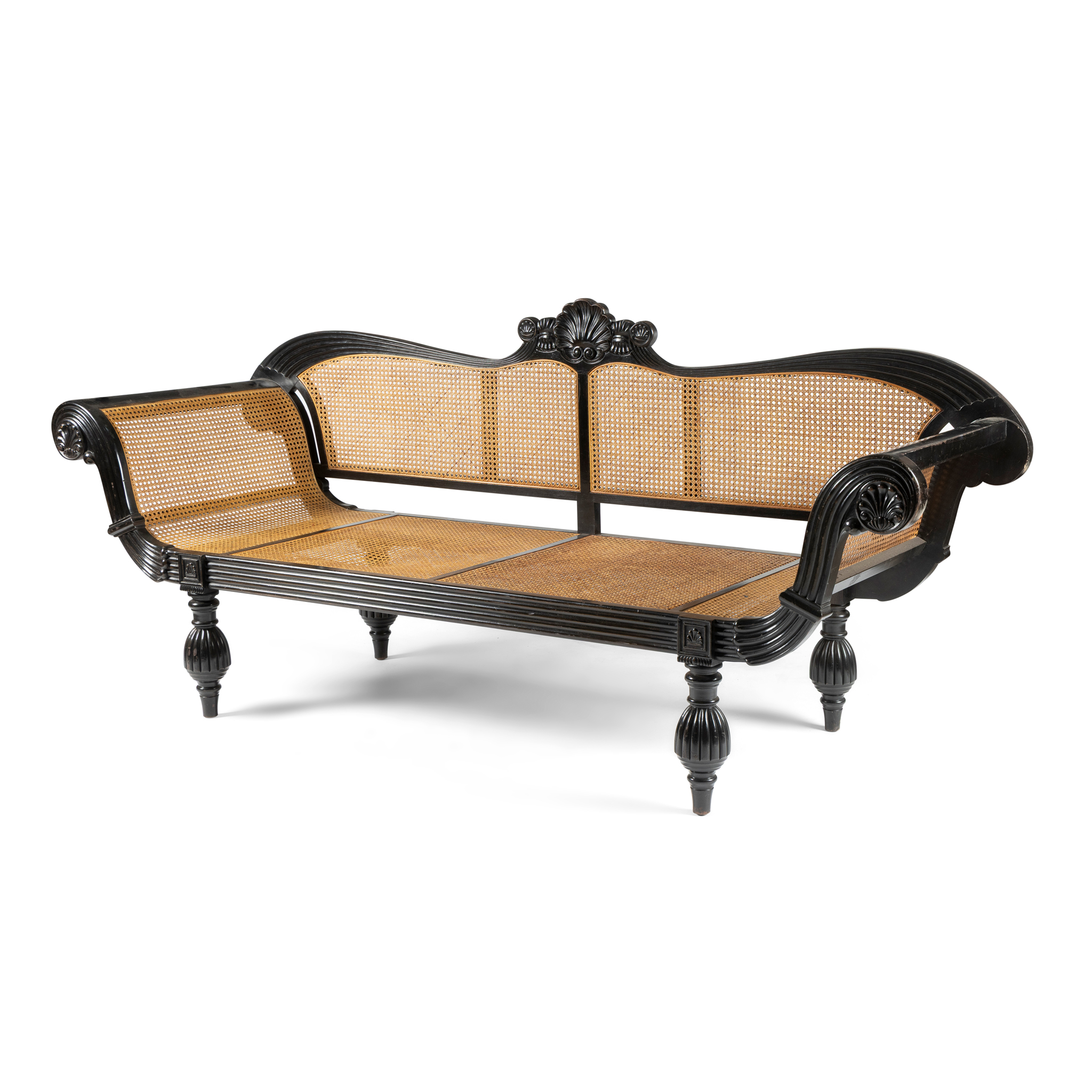 AN EBONISED AND CANED SOFA