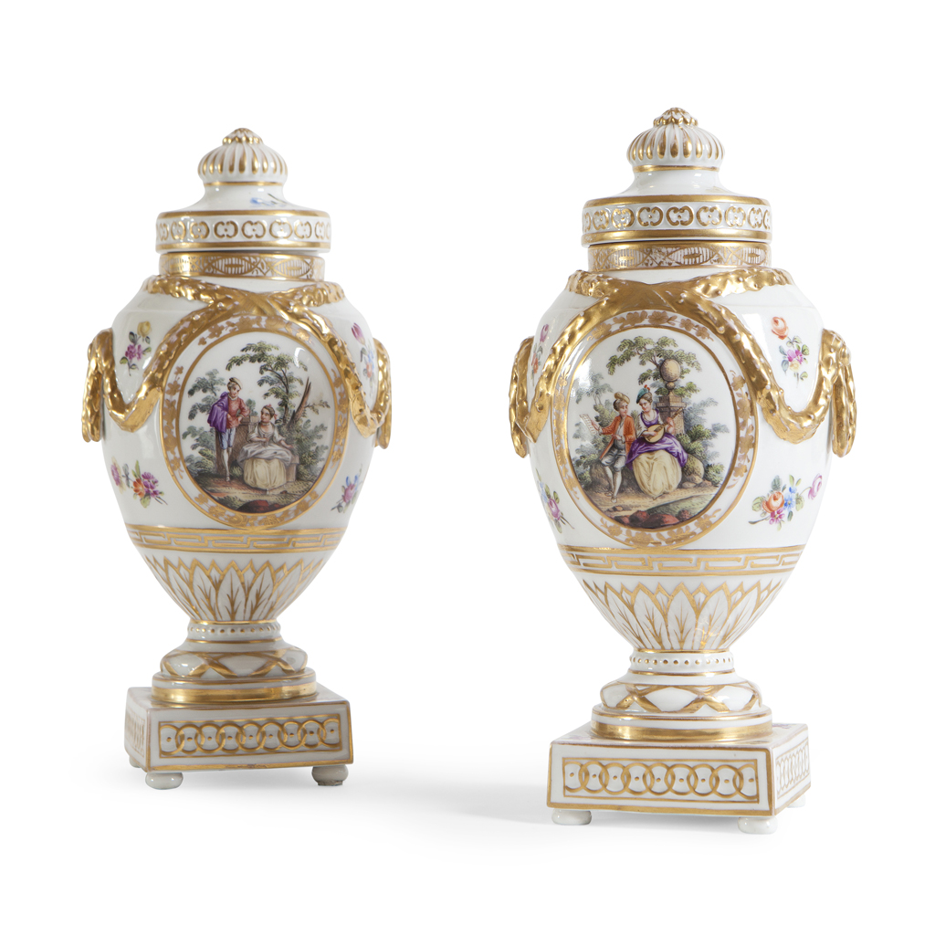 A PAIR OF KPM PORCELAIN URNS AND COVERS