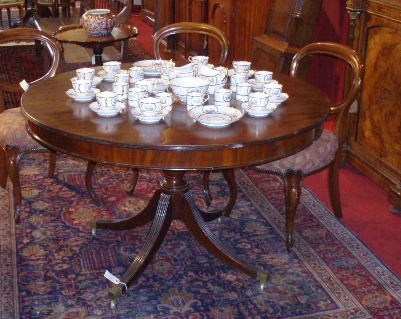 A Regency style mahogany extending dining table