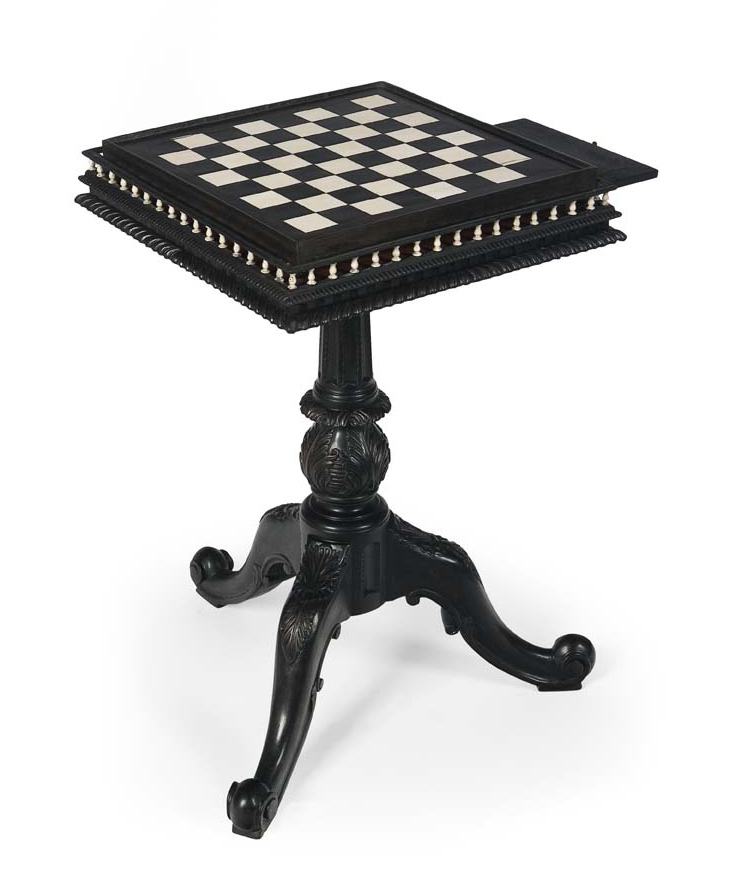 A mid 19th century Anglo Indian carved padouk and ebonised games table