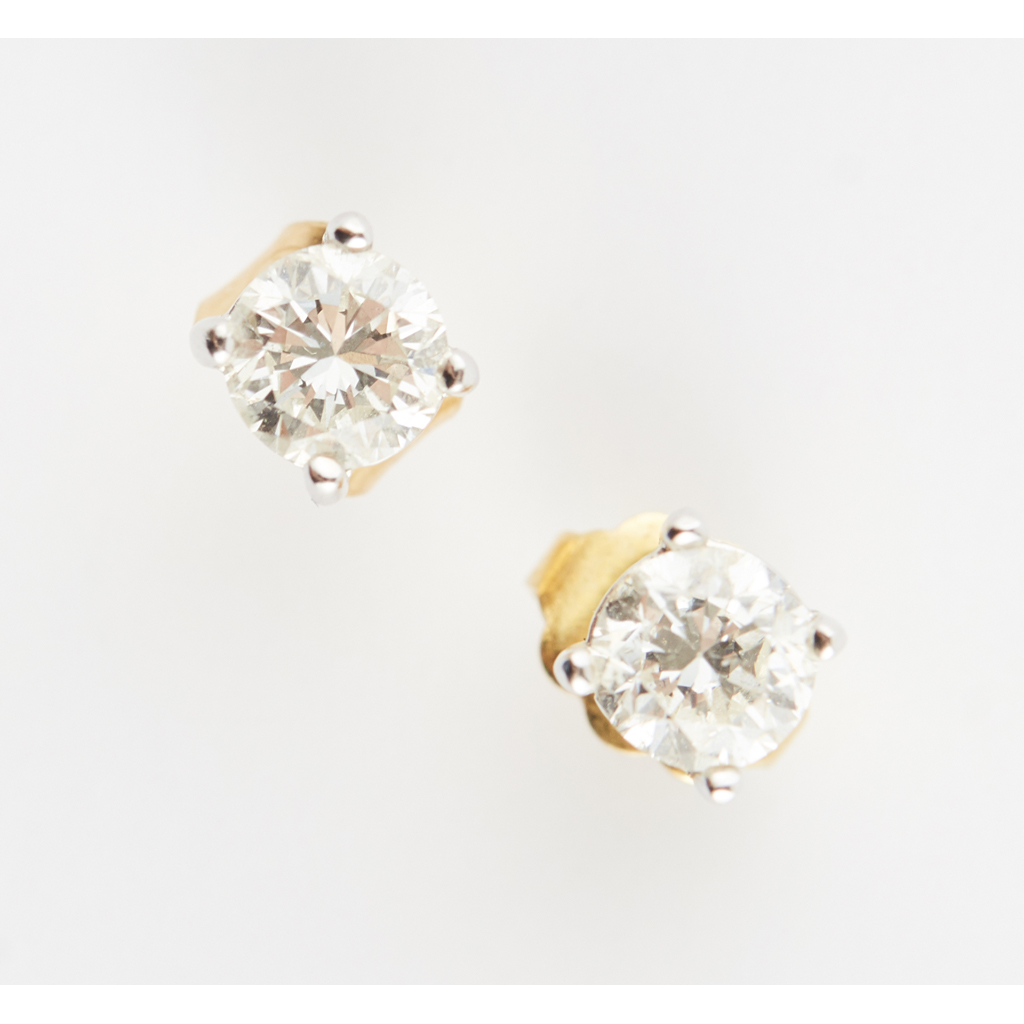 A pair of diamond stud earrings