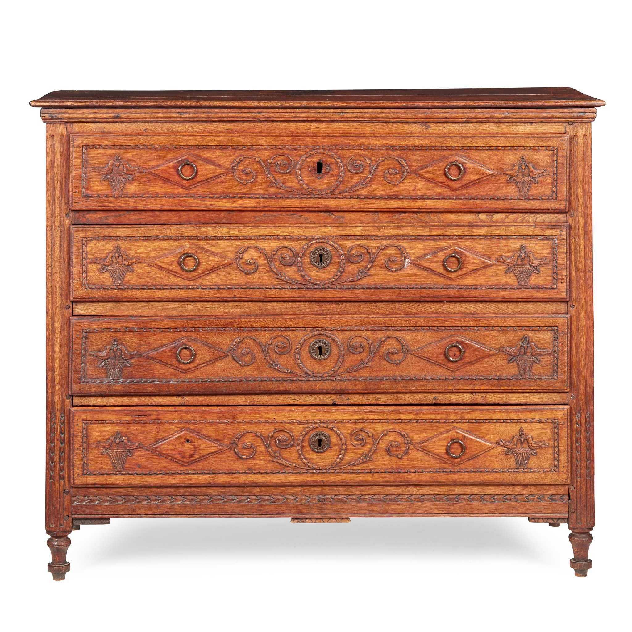 A FRENCH PROVINCIAL OAK CHEST OF DRAWERS