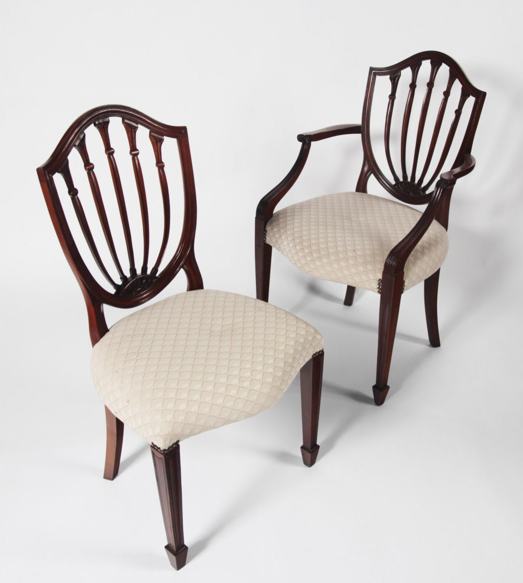 A set of eight Hepplewhite style mahogany dining chairs