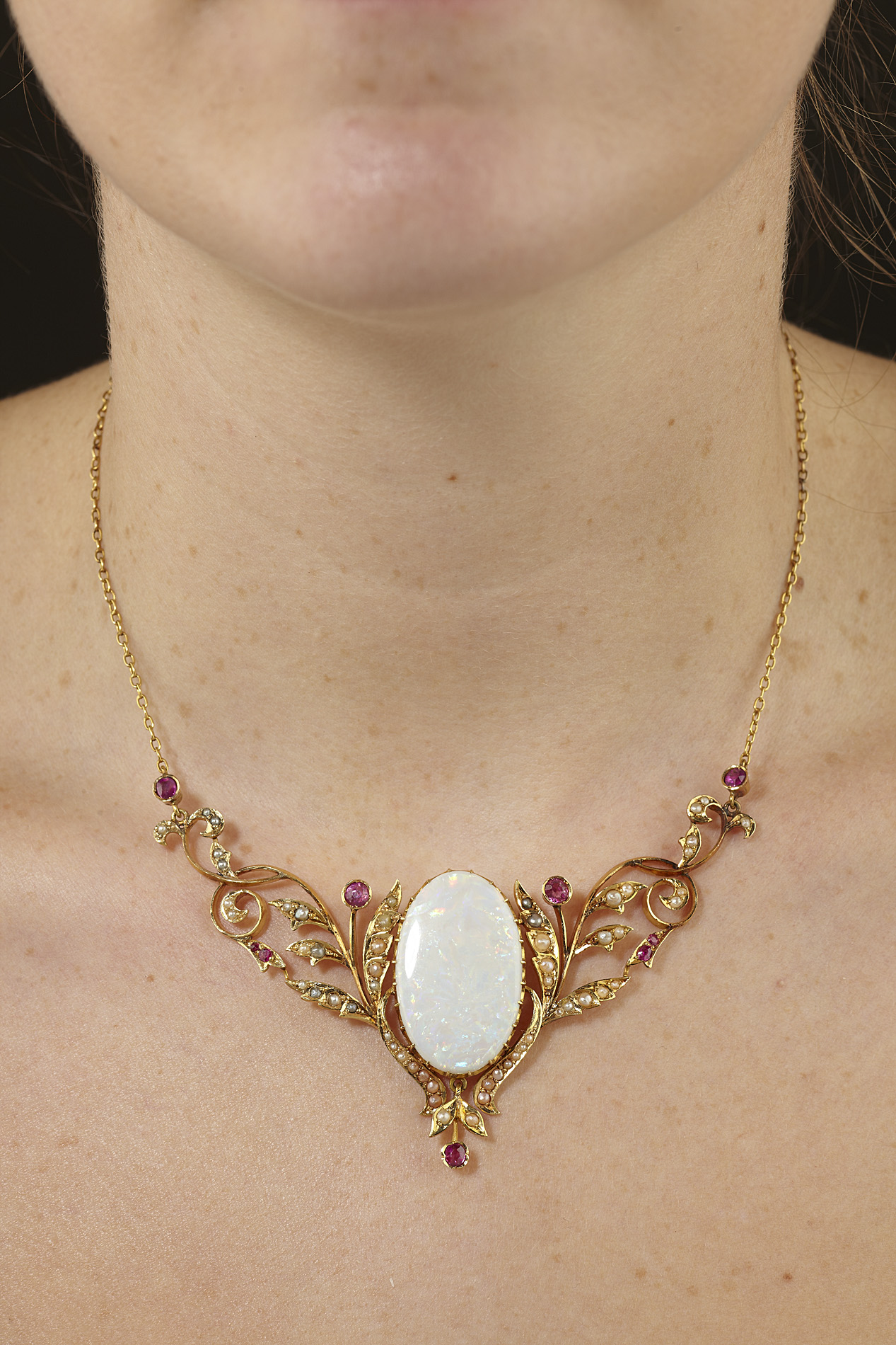 An early 20th century opal and multi-gem set necklace
