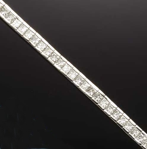 A platinum mounted diamond line bracelet,