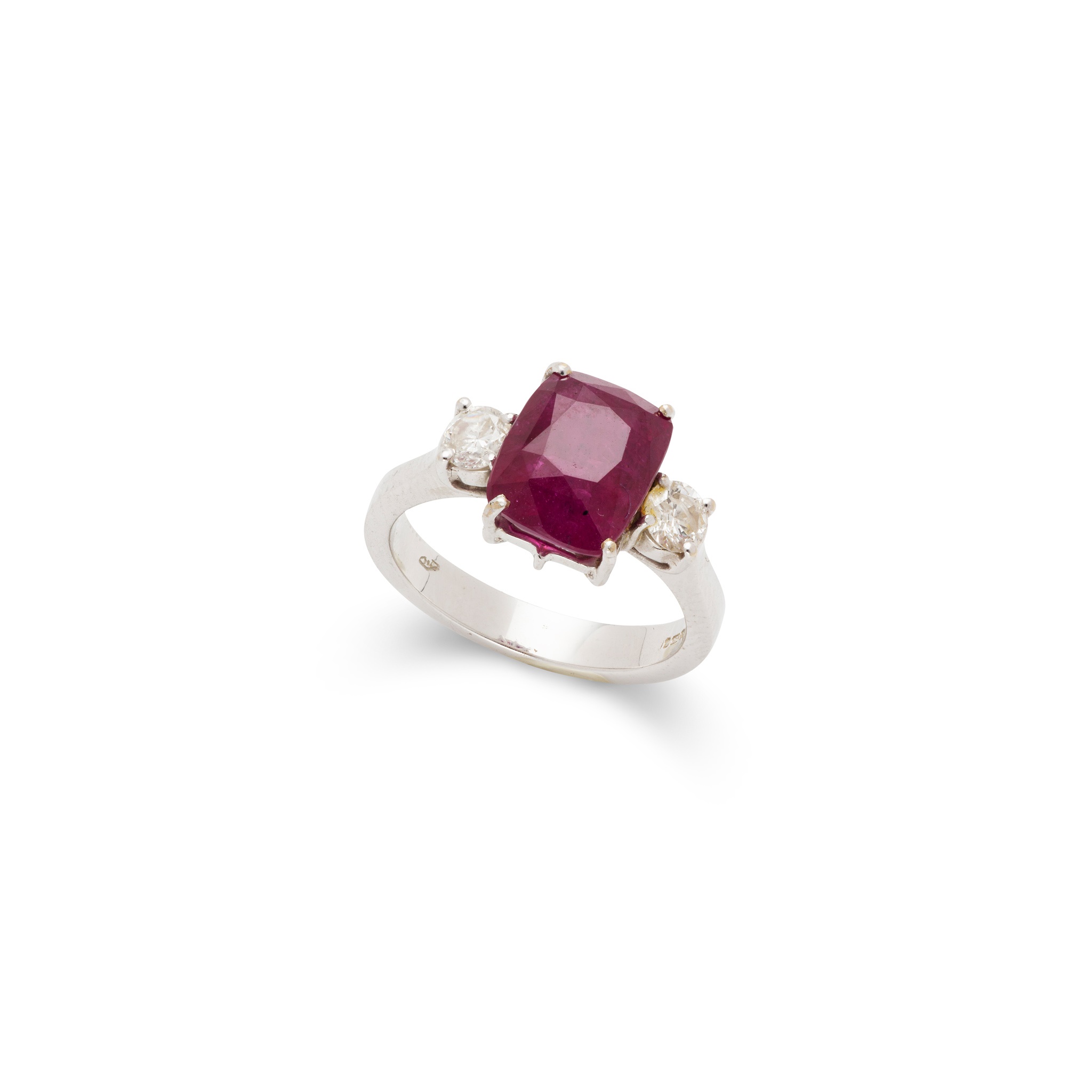 A ruby and diamond three-stone ring