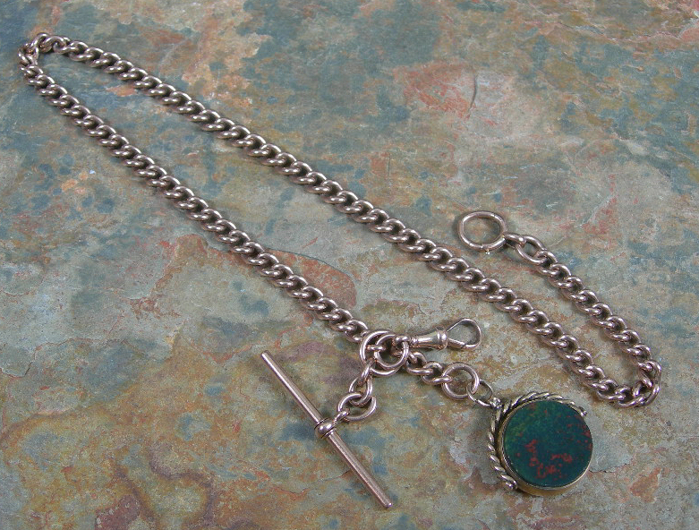 A 9ct rose gold double Albert chain,