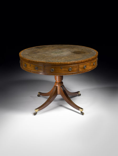 A Regency period mahogany drum library table