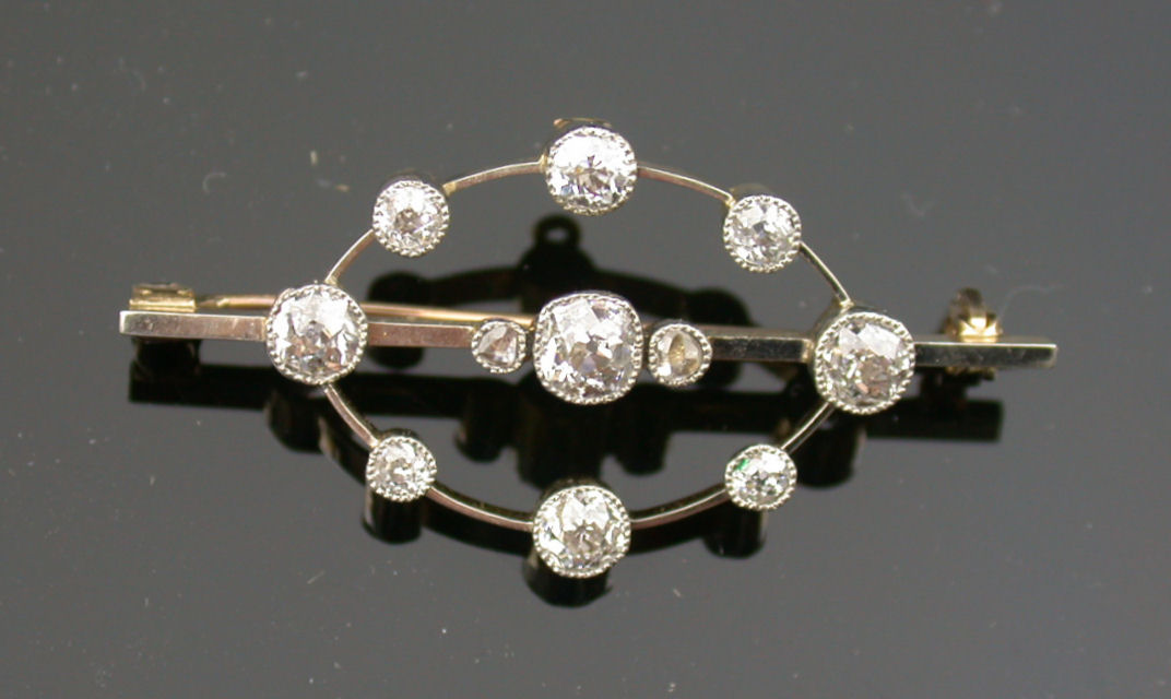 An early 20th century diamond bar brooch,