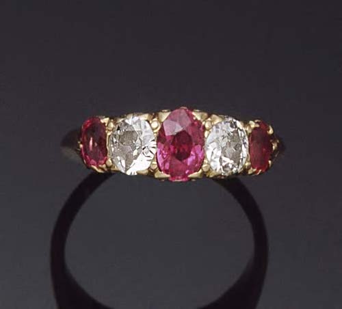 An 18ct gold mounted ruby and diamond five stone ring,