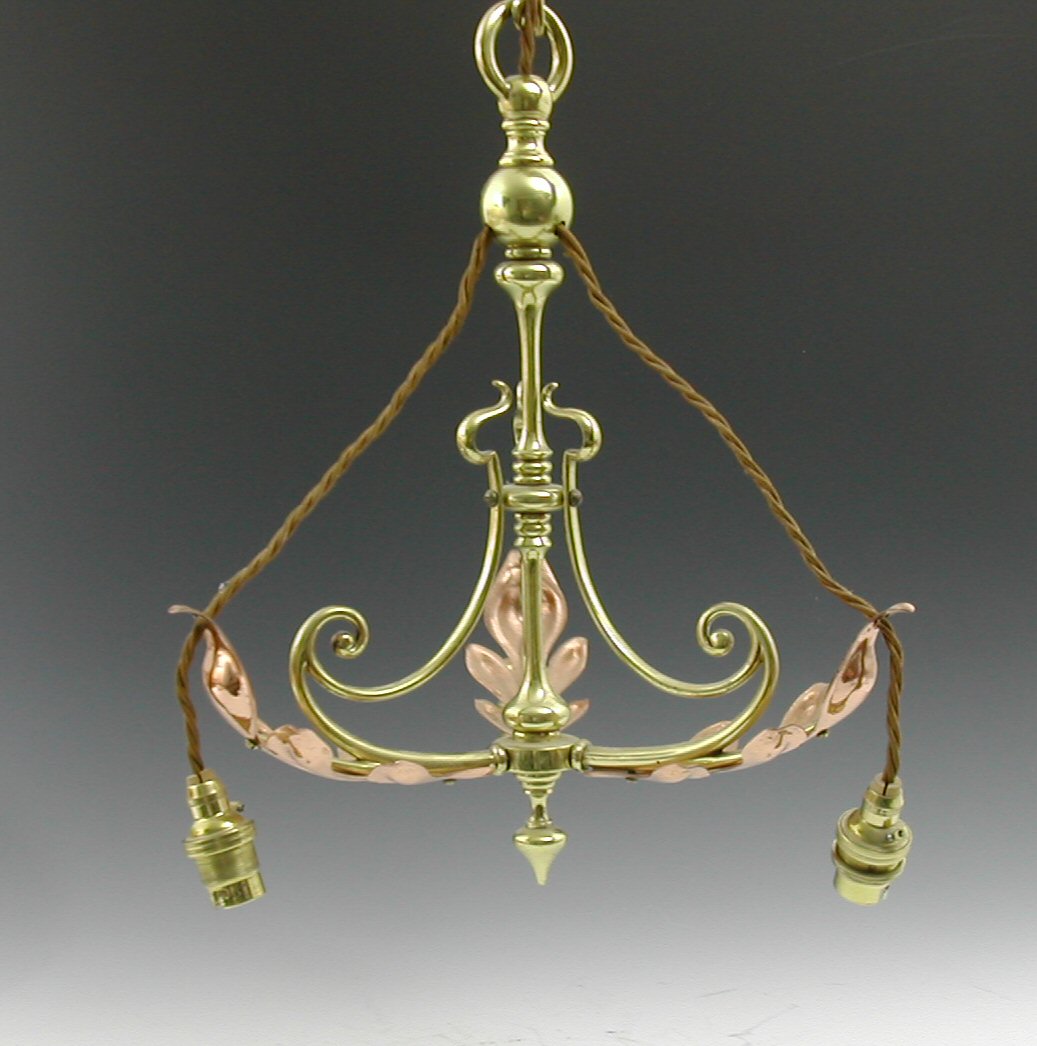 An Arts and Crafts brass and copper electrolier,
