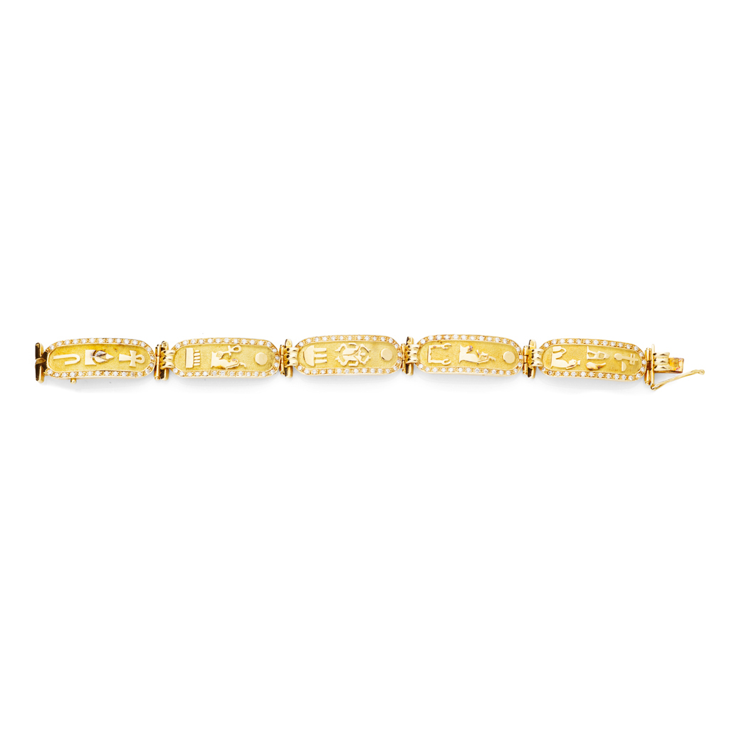 An Egyptian inspired gold and diamond set bracelet