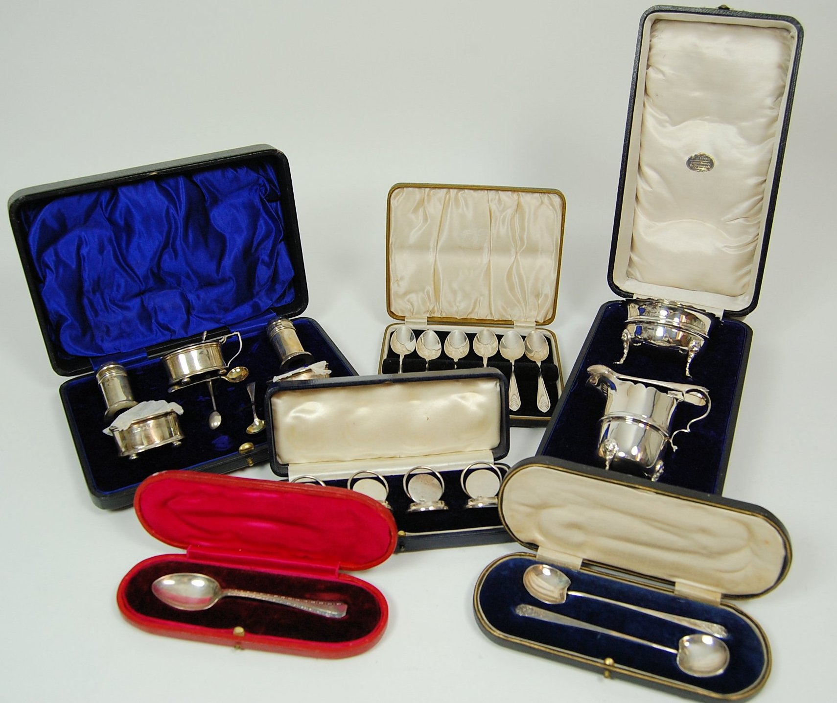 A cased sugar bowl and cream jug