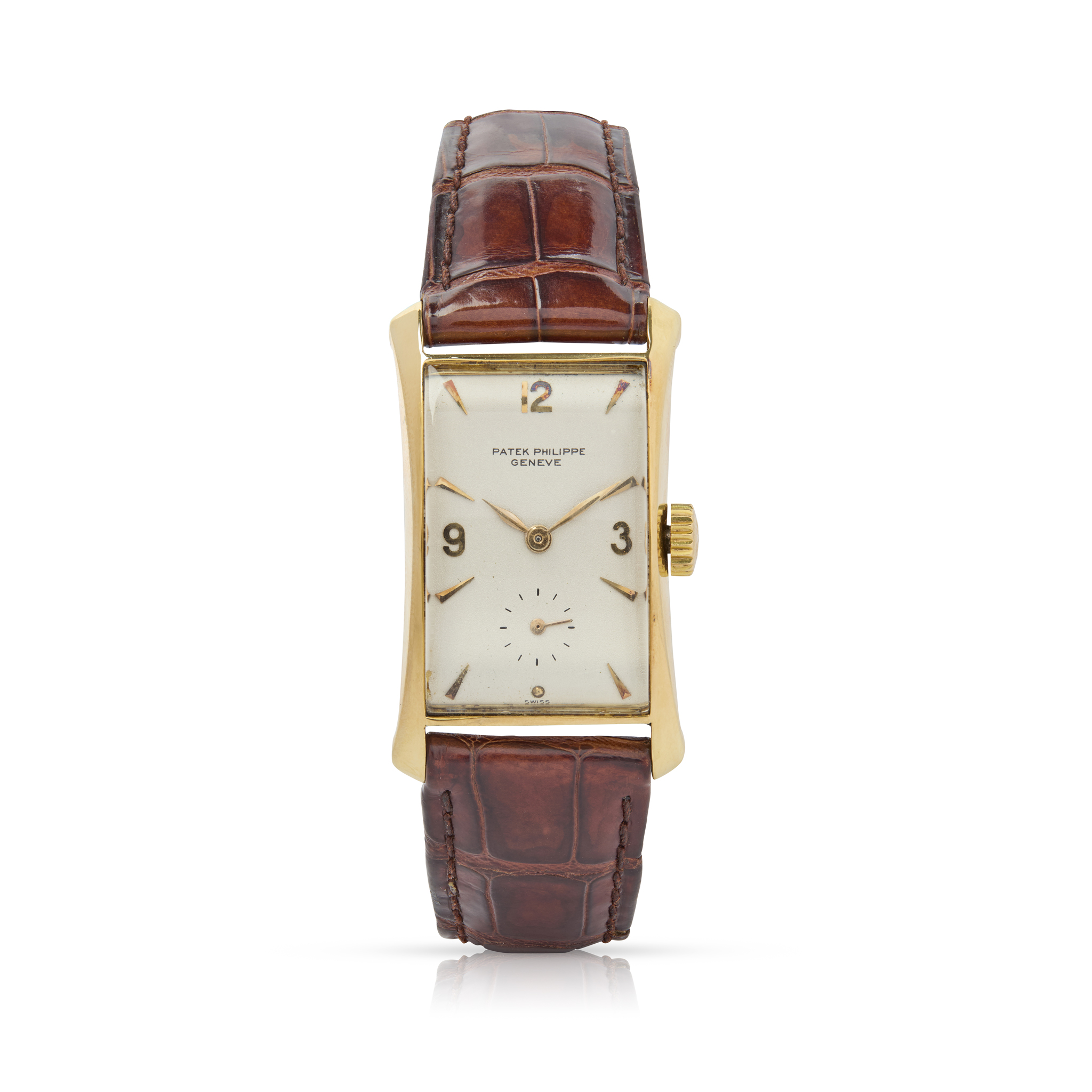 Patek Philippe. A fine and rare 18k yellow gold flared rectangular mechanical wristwatch