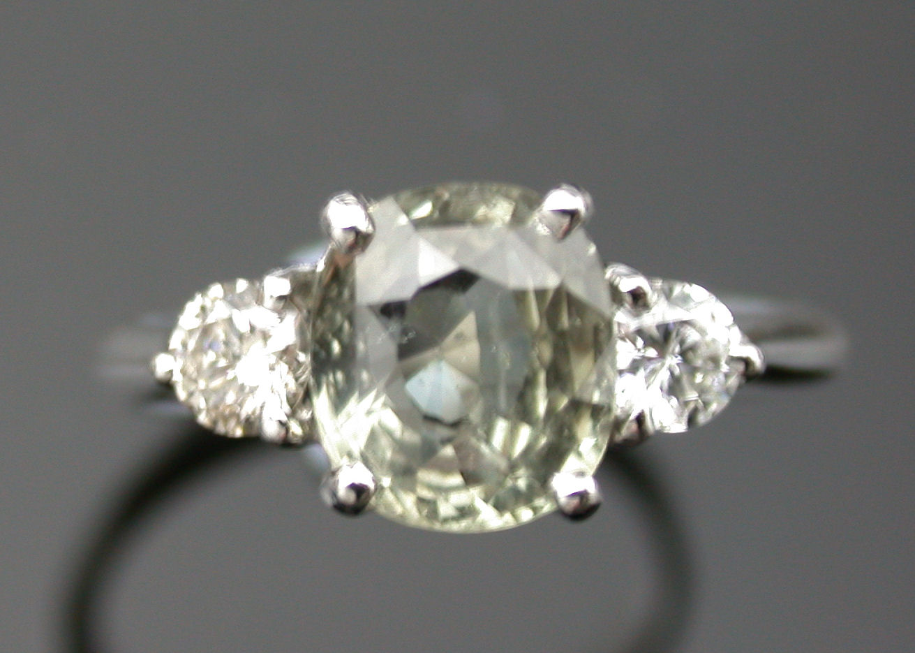 A green sapphire and diamond ring,