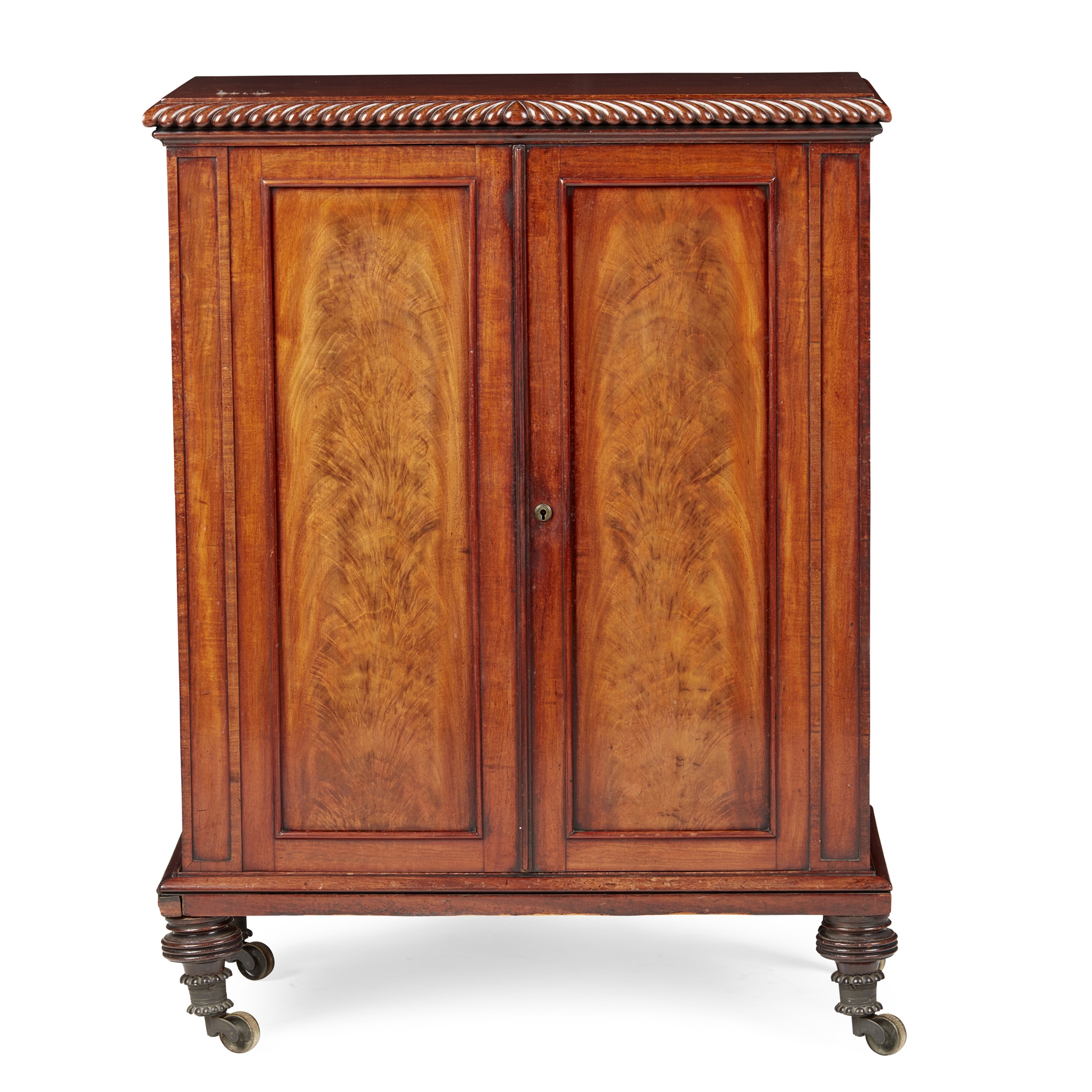 REGENCY MAHOGANY SMALL CENTRE LIBRARY CABINET, IN THE MANNER OF GILLOWS