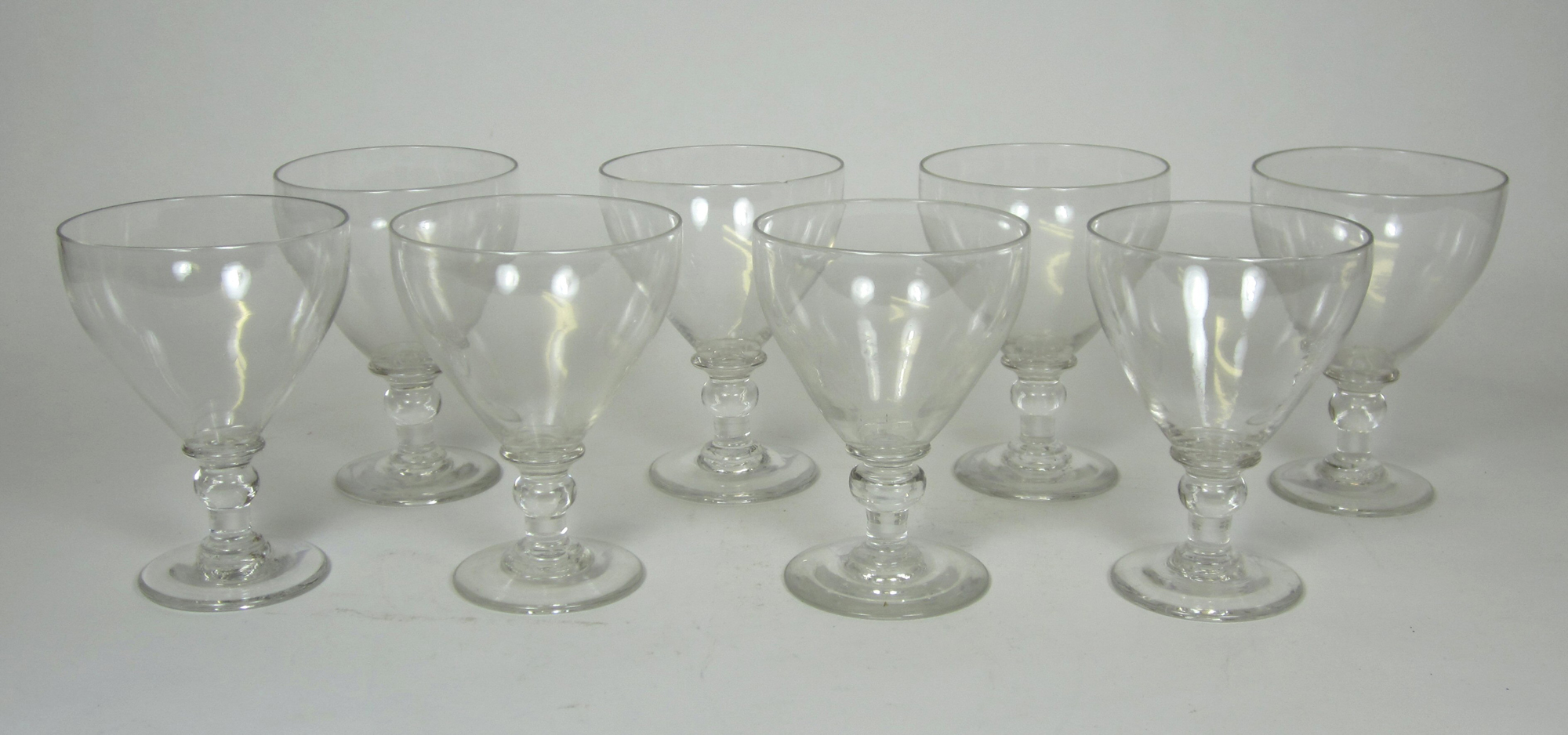 SET OF EIGHT GLASS RUMMERS