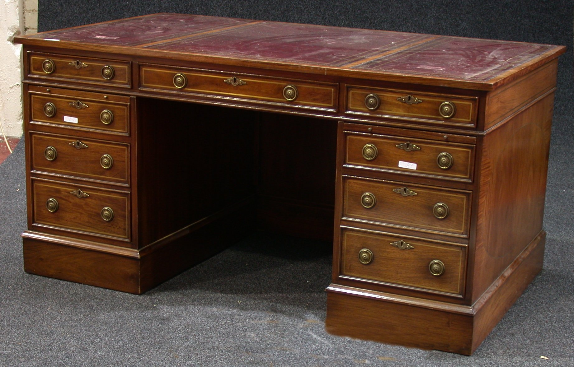 A reproduction mahogany twin pedestal desk,